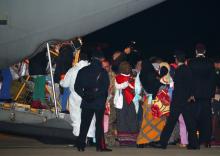 Evacuated migrants taken out of detention centres by the UNHCR from Tripoli in Libya arrive at the military airport Pratica di Mare in Rome, Italy, December 22, 2017. PHOTO BY REUTERS/Alessandro Bianchi