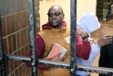 Handcuffed Pastor Evan Mawarire arrives at court after he was arrested for addressing students demonstrating over fees in Harare, Zimbabwe, June 28,2017. PHOTO BY REUTERS/Philimon Bulawayo