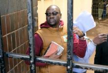 Handcuffed Pastor Evan Mawarire arrives at court after he was arrested for addressing students demonstrating over fees in Harare, Zimbabwe, June 28,2017. PHOTO BY REUTERS/Philimon Bulawayo