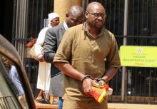 Pastor Evan Mawarire is escorted by detectives as he arrives at court to face charges of attempting to subvert the government, in Harare, Zimbabwe, September 26, 2017. PHOTO BY REUTERS/Philimon Bulawayo