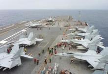 U.S. Navy FA-18 Hornets park on the flight deck of the USS George Washington during the Annual Exercise 2013, at sea, November 28, 2013. PHOTO BY REUTERS/Kyodo