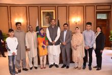 Nobel Peace Prize laureate Malala Yousafzai (4th-L) and her family members pose for a group photo with Pakistan's Prime Minister Shahid Khaqan Abbasi, in Islamabad, Pakistan, March 29, 2018. PHOTO BY REUTERS/PRESS INFORMATION DEPARTMENT (PID)