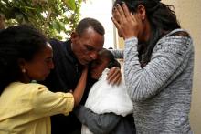 Addisalem Hadgu, 58, an Ethiopian state TV journalist, reacts after meeting his wife, Nitslal Abraha, 58, and his daughters, for the first time in eighteen years, in Asmara Eritrea, July 19, 2018. PHOTO BY REUTERS/Tiksa Negeri