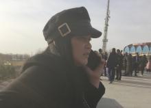 Fatima Musabayeva, 30, a slavery survivor, talks on the phone in the Baibidek park in Shymkent, southern Kazakhstan. PHOTO BY REUTERS