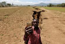 A man takes a selfie photograph near a chasm suspected to have been caused by a heavy downpour along an underground fault-line near the Rift Valley town of Mai Mahiu, Kenya, March 28, 2018. PHOTO BY REUTERS/Thomas Mukoya