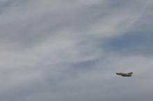 A Libyan fighter plane is pictured overhead during clashes between government forces and Islamist militants in Benghazi, Libya, March 5, 2016. PHOTO BY REUTERS/Esam Omran Al-Fetori