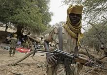 A fighter from the Justice and Equality Movement (JEM) stands guard during a meeting between JEM leader Khalil Ibrahim and field commanders and UN Special Envoy for Darfur Jan Eliasson and his African Union counterpart Salim Ahmed Salim at an undisclosed location in Sudan's Western Darfur region, April 18, 2008. PHOTO BY REUTERS/Stuart Price