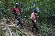 Fighters from the FDLR rebel group, which is being hunted by the Rwandan and Congolese army, move through the forest deep in the bush of eastern Congo