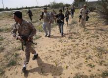 Fighters from Misrata move towards positions of Islamic State militants, near Sirte, March 15, 2015. PHOTO BY REUTERS/Goran Tomasevic