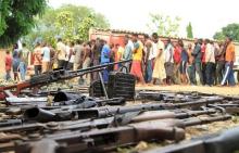 Suspected fighters are paraded before the media by Burundian police near a recovered cache of weapons after clashes in the capital Bujumbura, Burundi, December 12, 2015. PHOTO BY REUTERS/Jean Pierre Aime Harerimana