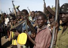 Jikany Nuer White Army fighters holds their weapons in Upper Nile State, South Sudan, February 10, 2014. PHOTO BY REUTERS/Goran Tomasevic