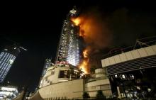 A fire engulfs The Address Hotel in downtown Dubai in the United Arab Emirates, December 31, 2015. PHOTO BY REUTERS/Ahmed Jadallah