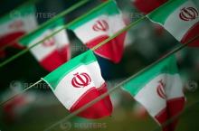 Iran's national flags are seen on a square in Tehran February 10, 2012, a day before the anniversary of the Islamic Revolution. PHOTO BY REUTERS/Morteza Nikoubazl