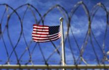 The U.S. flag flies over Camp VI, a prison used to house detainees at the U.S. Naval Base at Guantanamo Bay, in this file photo taken March 5, 2013. PHOTO BY REUTERS/Bob Strong