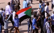 Sudanese demonstrators chant slogans as they march along the street during anti-government protests in Khartoum, Sudan, December 25, 2018. PHOTO BY REUTERS/Mohamed Nureldin Abdallah