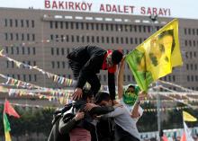 A man holds a flag with a picture of imprisoned Kurdish rebel leader Abdullah Ocalan during a gathering to celebrate Newroz, which marks the arrival of spring and the new year, in Istanbul, Turkey, March 21, 2018. PHOTO BY REUTERS/Murad Sezer