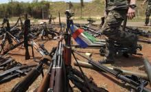 A Central African Republic flag is seen on a gun, which is diplayed among other arms confiscated from ex-Seleka rebels and "anti-balaka" militia by the French military of Operation Sangaris at a French military base in Bangui