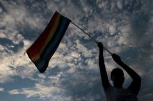 A participant holds up a rainbow flag during a gay pride parade in Managua, Nicaragua, June 28, 2016. PHOTO BY REUTERS/Oswaldo Rivas