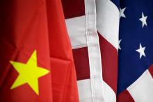 Flags of U.S. and China are displayed at American International Chamber of Commerce (AICC)'s booth during China International Fair for Trade in Services in Beijing, China, May 28, 2019. PHOTO BY REUTERS/Jason Lee