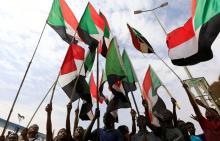 People wave national flags in a file photo during a protest in Khartoum, Sudan, August 1, 2019. PHOTO BY REUTERS/Mohamed Nureldin Abdallah