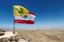 Lebanese and Hezbollag flags are seen in Juroud Arsal, Syria-Lebanon border, July 25, 2017. PHOTO BY REUTERS/Mohamed Azakir