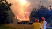 Firefighters work at the scene of a bushfires in Bilpin, New South Wales, Australia in this still image from a social media video December 15, 2019.S/PHOTO BY REUTERAndrew Mitchell/Cottage Point Rural Fire Brigade