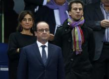 France's President Francois Hollande attends the friendly soccer match between France and Portugal at the Stade de France in Saint-Denis near Paris