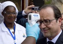 French President Francois Hollande has his temperature measured upon his arrival at the Donka Hospital in Conakry, November 28, 2014, as part of a one-day visit in Guinea focused on Ebola. PHOTO BY REUTERS/Alain Jocard