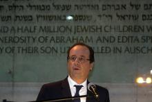 French President Francois Hollande speaks during his visit to the Hall of Remembrance