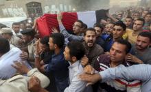 Relatives of 21-year-old Egyptian army officer Mohamed Adel, who was killed in a militant attack in the Sinai peninsula, carry his coffin during his funeral in Al-Kaliobeya, near Cairo, Egypt, July 2, 2015 file. PHOTO BY REUTERS/Mohamed Abd El Ghany