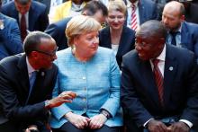 Rwanda's President Paul Kagame, German Chancellor Angela Merkel and South Africa's President Cyril Ramaphosa attend the G20 Compact with Africa Conference in Berlin, Germany, October 30, 2018. PHOTO BY REUTERS/Axel Schmidt