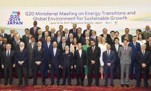 Ministers and delegates, including Japan's Minister of Economy, Trade and Industry Hiroshige Seko and Environment Minister Yoshiaki Harada, gather for a family photo session at G20 energy and environment ministers meeting in Karuizawa, Japan June 15, 2019, in this photo taken by Kyodo. PHOTO BY REUTERS