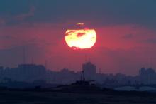 The sun sets over the Gaza Strip, as seen from the Israeli side, September 2016. PHOTO BY REUTERS/Amir Cohen