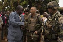 General Francisco Soriano, (C) commander of the French forces in the Central African Republic, greets a community leader in a largely Muslim neighbourhood of Yaloke town