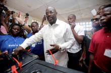 George Weah, former soccer player and presidential candidate of Congress for Democratic Change (CDC), votes at a polling station in Monrovia, Liberia, October 10, 2017. PHOTO BY REUTERS/Thierry Gouegnon
