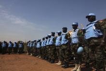 Ghanian U.N. peacekeepers stand at attention upon arriving in Juba