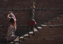 A girl carries bricks to be baked in a kiln at a brickyard on the outskirts of Karad in Satara district, about 396km (246 miles) south of Mumbai, February 13, 2012. PHOTO BY REUTERS/Danish Siddiqui