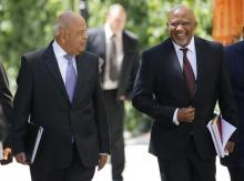 South Africa's Deputy Finance Minister Mcebisi Jonas (R) arrives with Finance Minister Pravin Gordhan for Gordhan's 2016 Budget address in Cape Town, February 24, 2016.PHOTO BY REUTERS