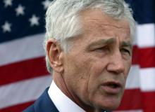 U.S. Secretary of Defense Chuck Hagel speaks to reporters at the Al Udeid Airbase, west of Doha