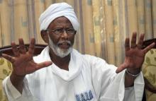 Leading Sudanese opposition figure Hassan al-Turabi gestures during an interview in Khartoum