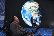Physicist Stephen Hawking sits on stage during an announcement of the Breakthrough Starshot initiative with investor Yuri Milner in New York, April 12, 2016. PHOTO BY REUTERS/Lucas Jackson
