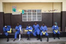 Ebola health workers rest outside a quarantine zone at a Red Cross facility in the town of Koidu, Kono district in Eastern Sierra Leone, December 19, 2014. PHOTO BY REUTERS/Baz Ratner