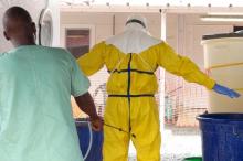 A health worker gets sprayed with disinfectant in an Ebola virus treatment center in Conakry, Guinea, November 17, 2015. PHOTO BY REUTERS/Saliou Samb