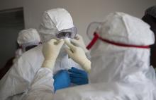 Health workers wearing protective equipment are pictured at the Island Clinic in Monrovia, September 30, 2014, where patients are treated for Ebola