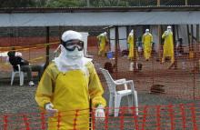 Medicins Sans Frontieres (MSF) health workers prepare at ELWA's isolation camp during the visit of Senior United Nations (U.N.) System Coordinator for Ebola David Nabarro, at the camp in Monrovia, August 23, 2014. PHOTO BY REUTERS/2Tango