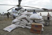 Boxes and sacks of food are unloaded from a U.N. helicopter in Pibor, January 12, 2012. PHOTO BY REUTERS/Isaac Billy