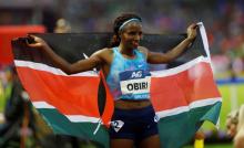 Hellen Obiri of Kenya celebrates winning the Women's 5000 meters. PHOTO BY REUTERS/Francois Lenoir