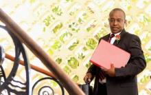 Kenya's Cabinet Secretary of National Treasury (Finance Minister) Henry Rotich carries a briefcase containing the Government Budget for the 2013/14 fiscal year inside the parliament building in Nairobi, June 13, 2013. PHOTO BY REUTERS/Noor Khamis