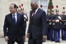 French President Francois Hollande (L) welcomes Angola's President Jose Eduardo dos Santos at the Elysee Palace in Paris
