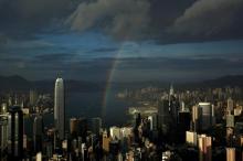 A rainbow arches over Hong Kong's Victoria Harbour, June 19, 2012. PHOTO BY REUTERS/Bobby Yip